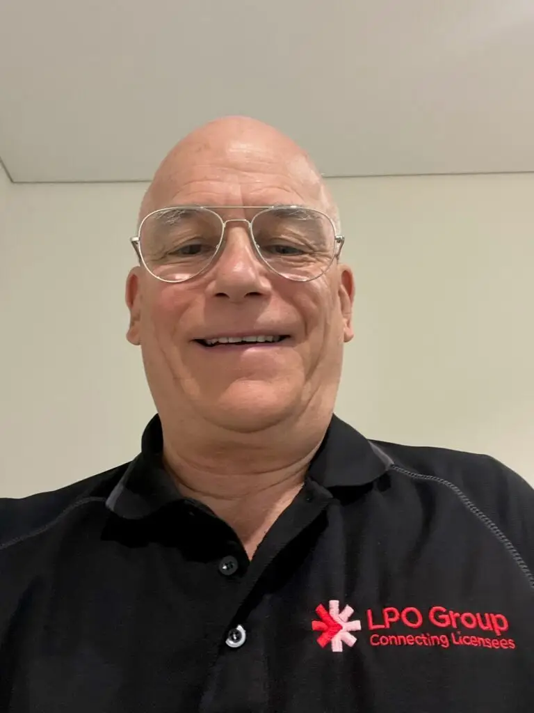 Smiling man wearing LPO Group polo shirt